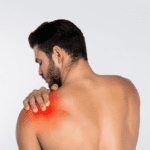 A Man having pain and holding his shoulder