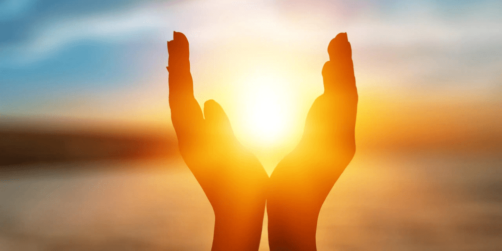 Healing hands between the sunset.