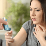 A women being given an inhaler.